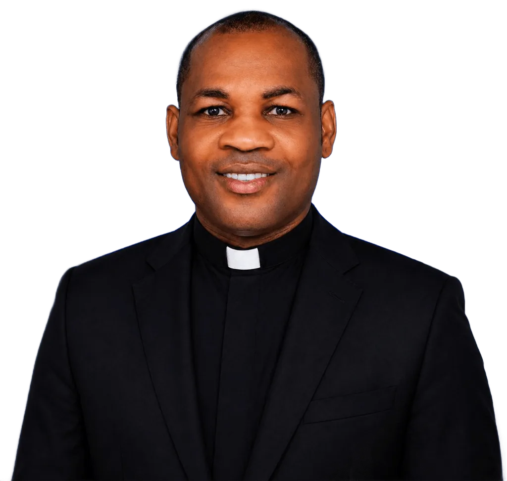 The Venerable Alex Uzor in a black suit and clerical collar