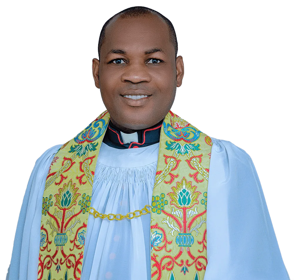 The Venerable Alex Uzor in surplice and an embroidered green-and-gold stole